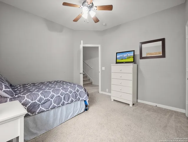 a bedroom with a bed and a cabinets