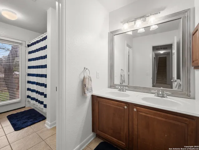 a bathroom with a sink a vanity and a mirror