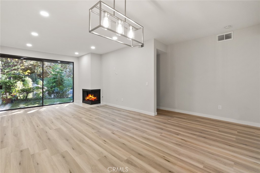 2504 West MacArthur Boulevard Santa Ana, CA 92704 - Photo 1 of 19 a view of empty room with wooden floor and fan