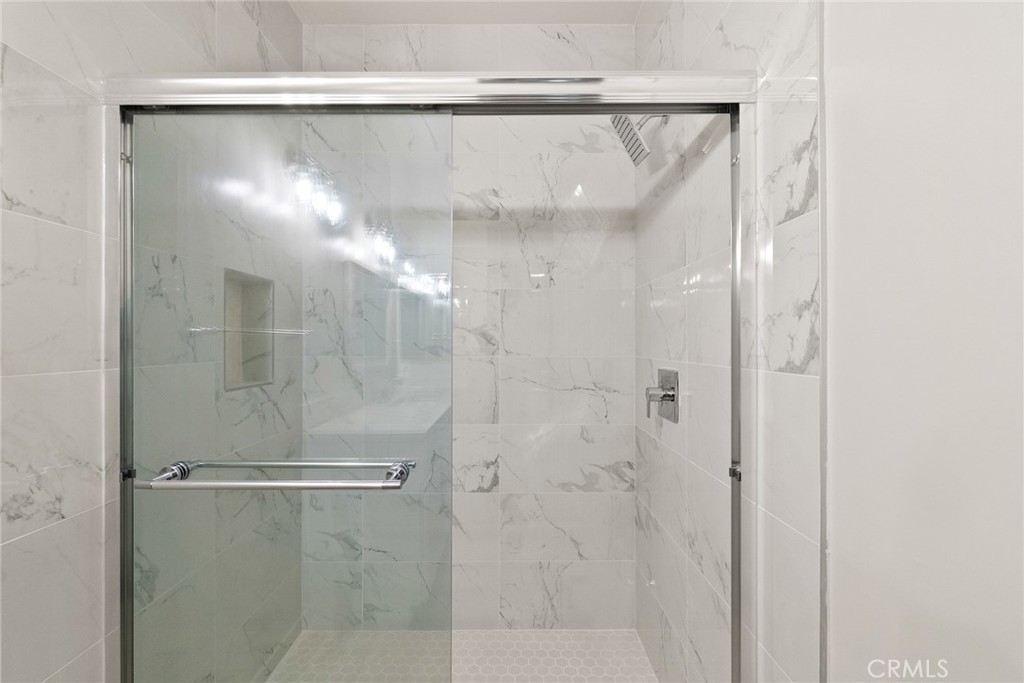 2504 West MacArthur Boulevard Santa Ana, CA 92704 - Photo 12 of 19 a bathroom with a glass shower door