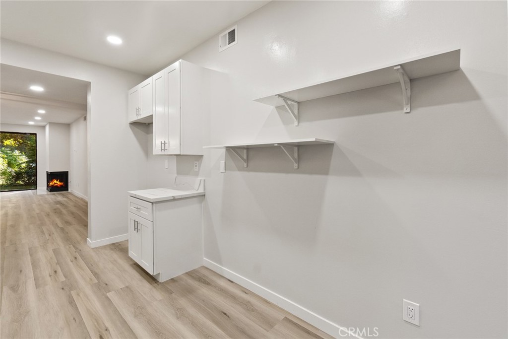 2504 West MacArthur Boulevard Santa Ana, CA 92704 - Photo 7 of 19 a view of hallway with washer and dryer