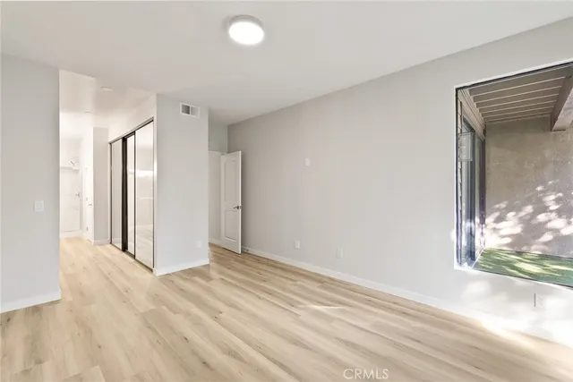 a view of entryway with wooden floor