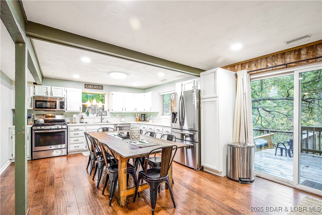 258 Northview Road Sunrise Beach, MO 65079 - Photo 21 of 29 Expansive Kitchen with tons of cabinetry and seati