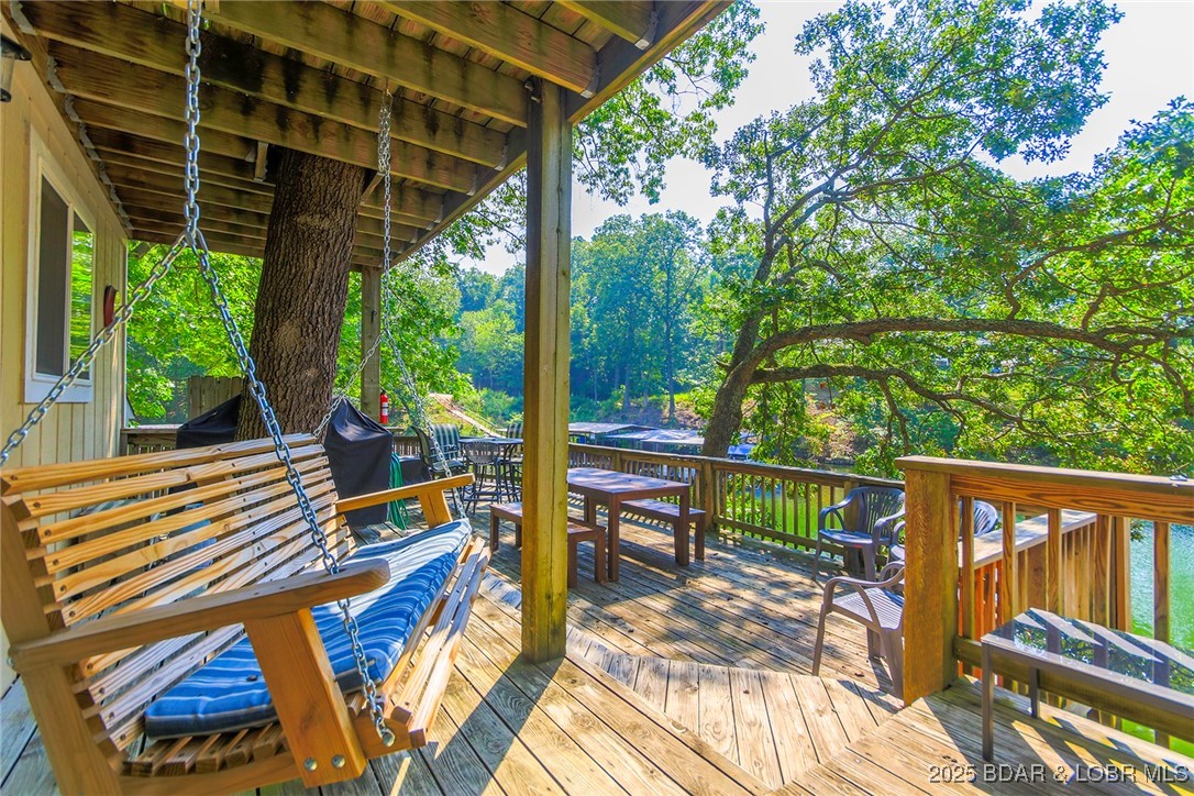 258 Northview Road Sunrise Beach, MO 65079 - Photo 24 of 29 Expansive Deck with plenty of seating.