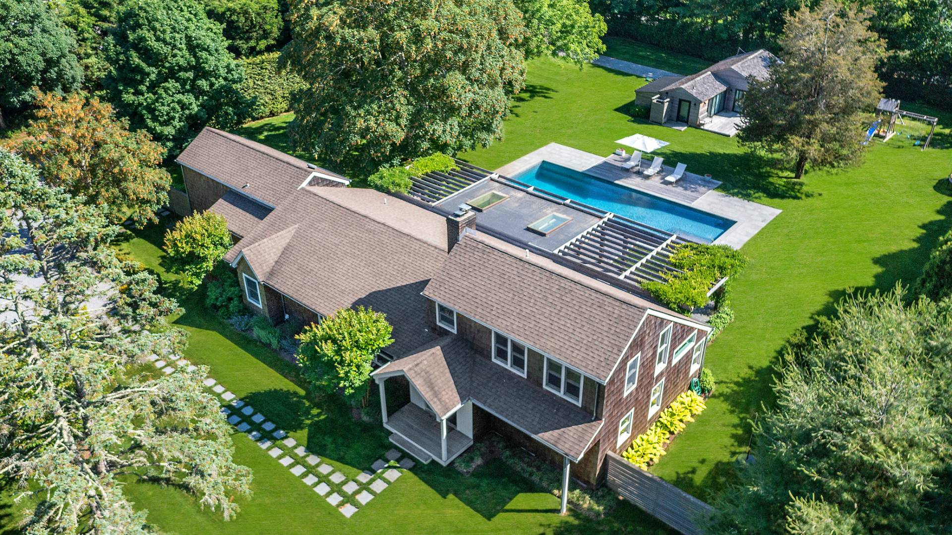4 Jericho Close Lane East Hampton, NY 11937 - Photo 2 of 26 an aerial view of a house with garden space and street view