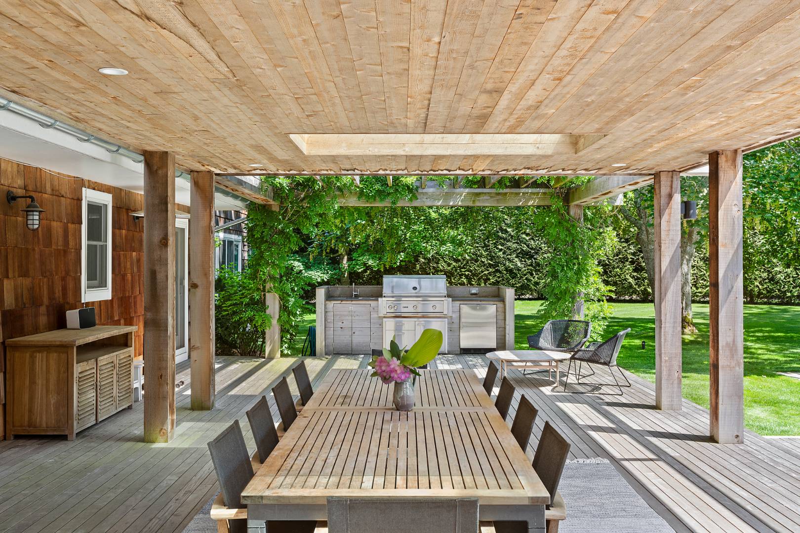 4 Jericho Close Lane East Hampton, NY 11937 - Photo 20 of 26 a view of a patio with a table chairs and a patio