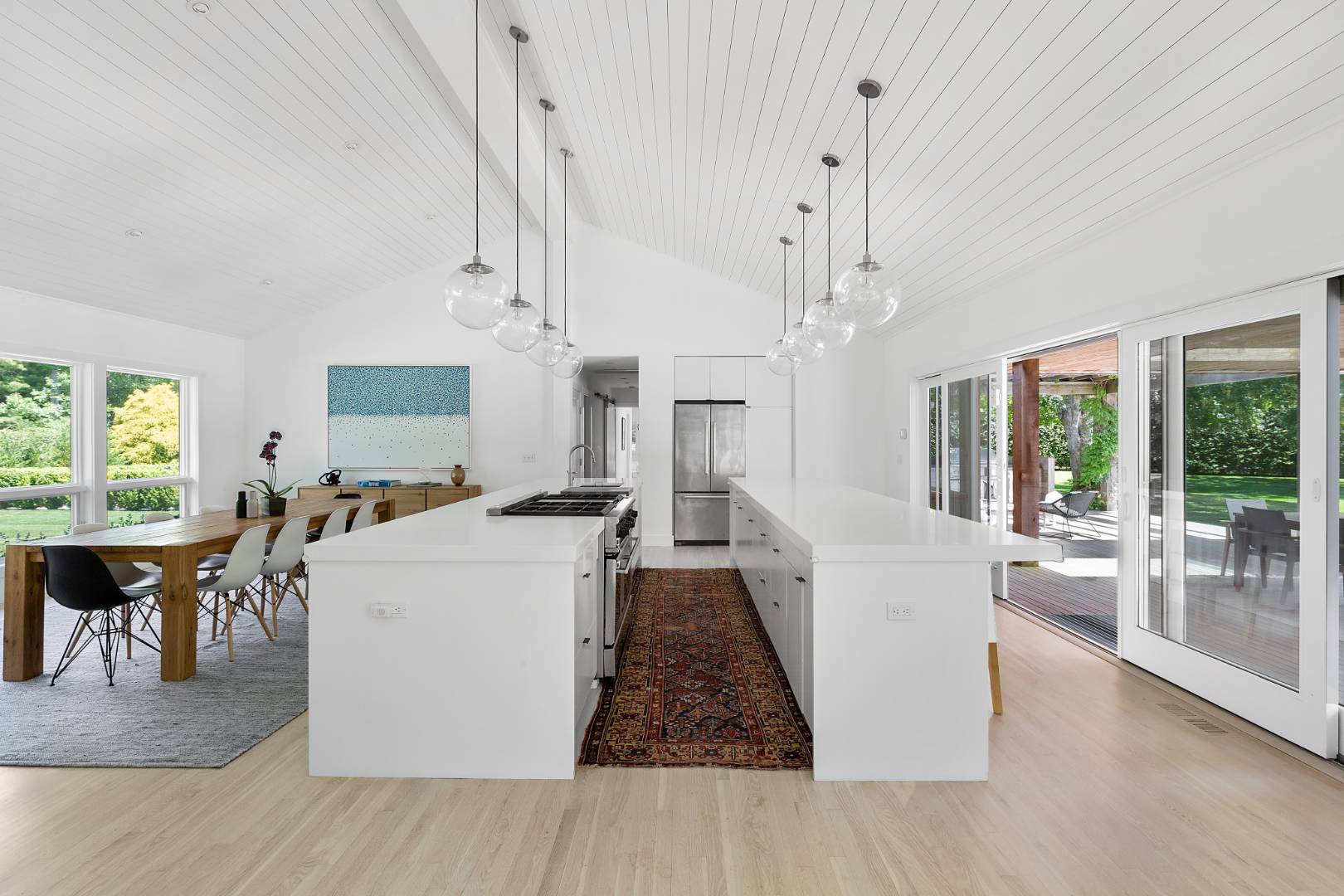 4 Jericho Close Lane East Hampton, NY 11937 - Photo 6 of 26 a living room with furniture a dining table and a large window with wooden floor