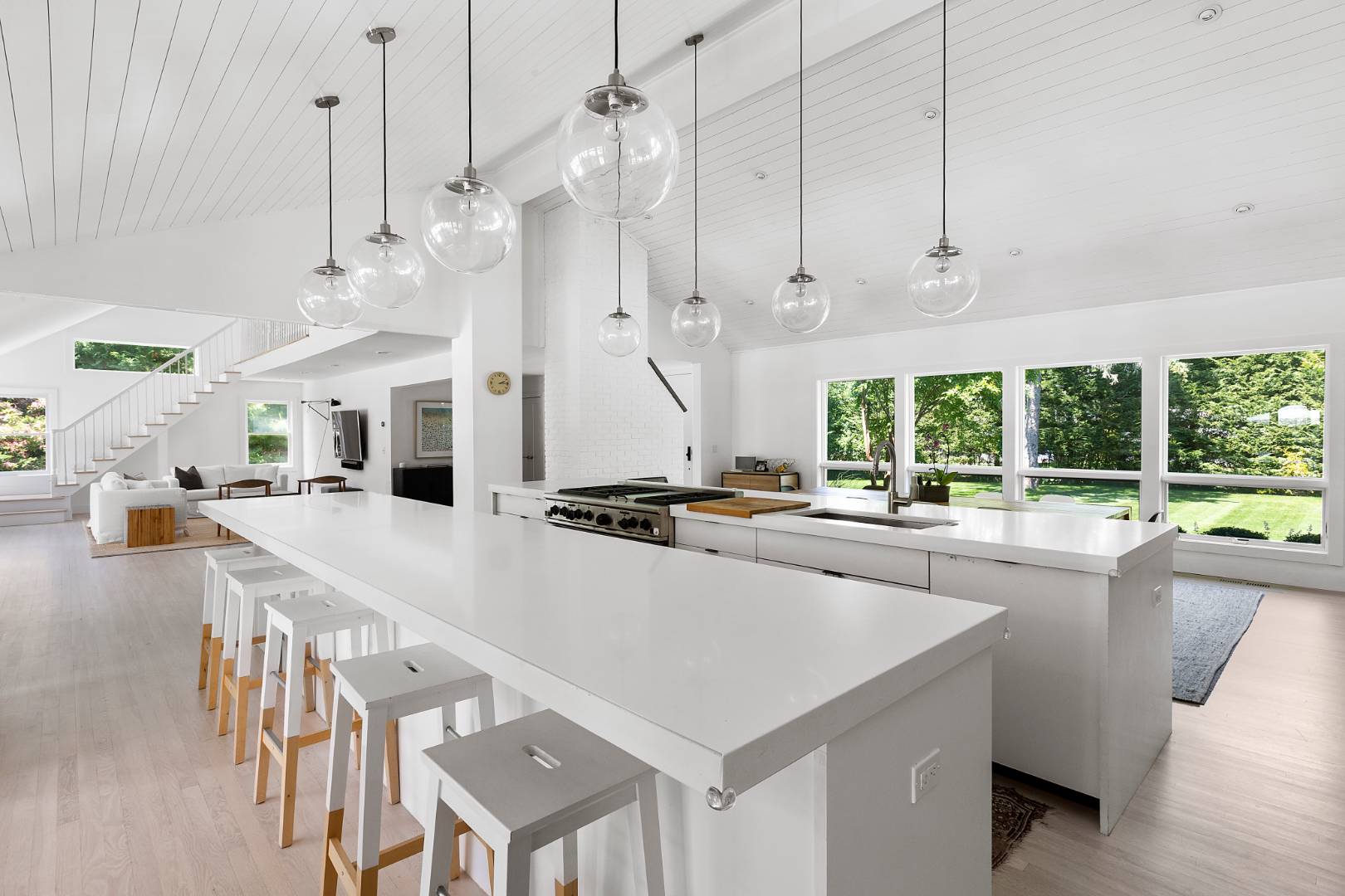 4 Jericho Close Lane East Hampton, NY 11937 - Photo 7 of 26 a large kitchen with kitchen island a large counter top space a sink stainless steel appliances and cabinets