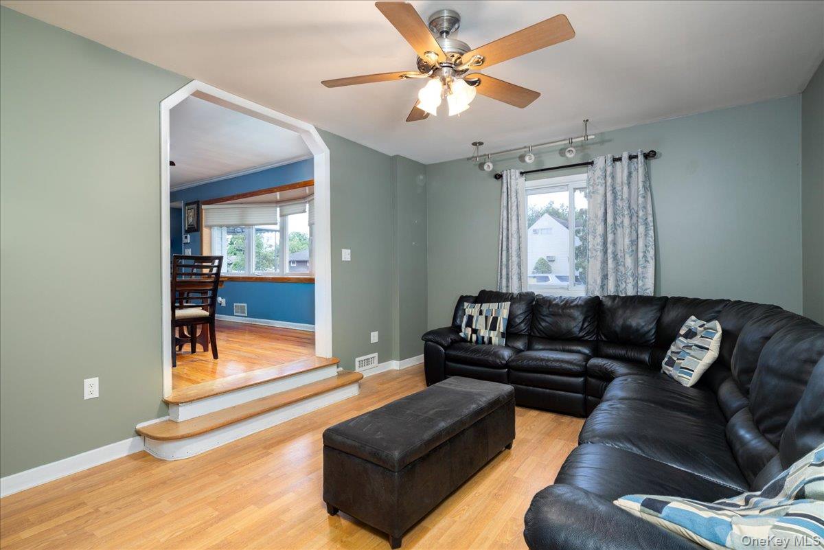 11 Adelphi Road Hicksville, NY 11801 - Photo 11 of 26 a living room with furniture and a large window