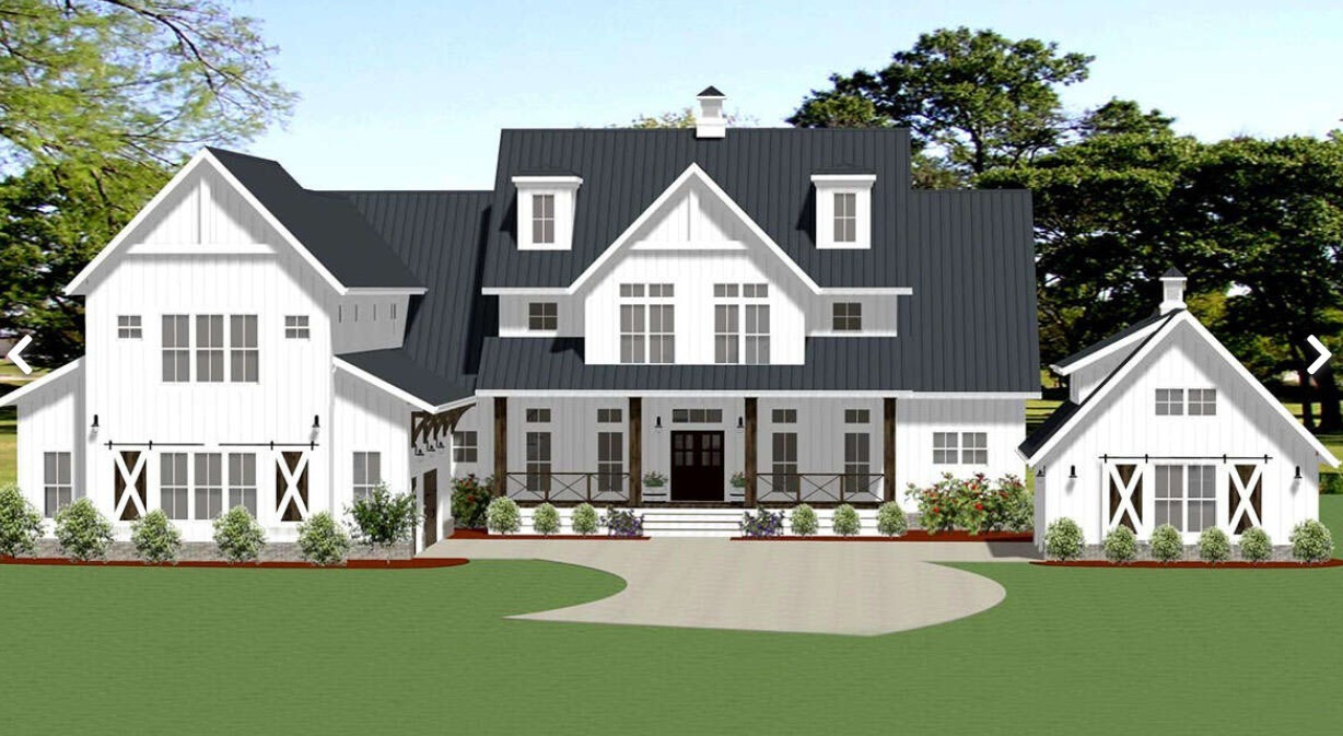 a view of house with yard and green space