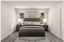 a bedroom with a large bed and a window