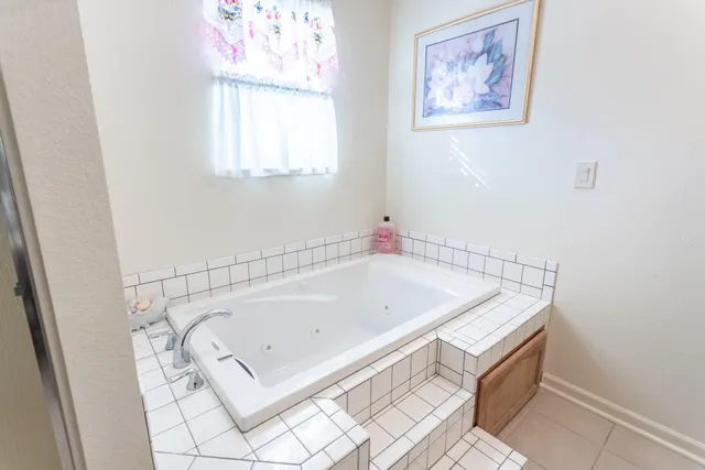 a view of a patio with table and chairs and potted plants