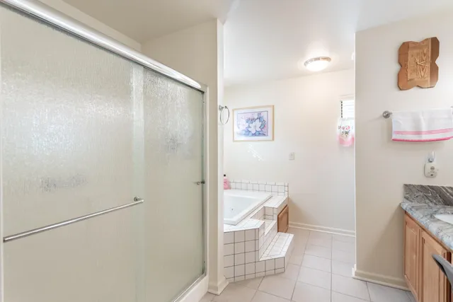 a view of a patio with table and chairs and potted plants