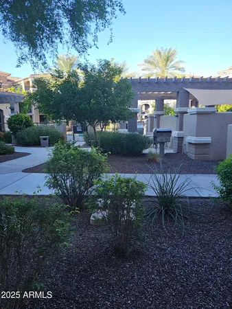 a view of a patio with a table and chairs
