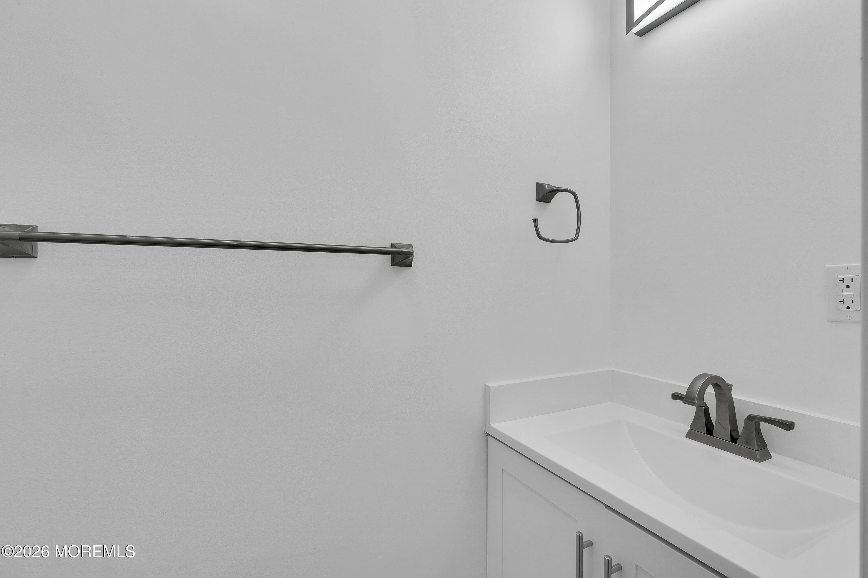 15 Wyckham Road Spring Lake Heights, NJ 07762 - Photo 14 of 38 a bathroom with a sink and vanity