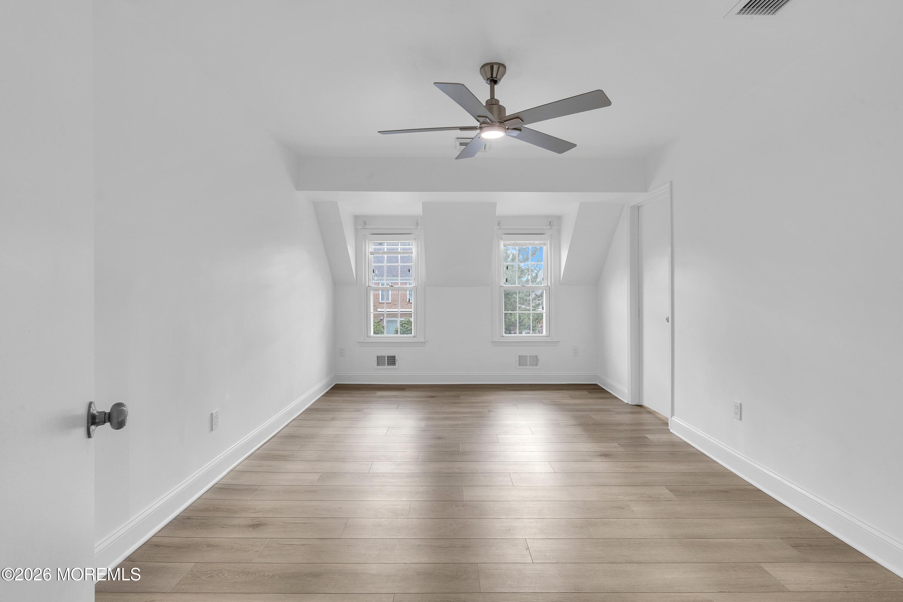 15 Wyckham Road Spring Lake Heights, NJ 07762 - Photo 19 of 38 a view of a room with wooden floor closet and windows