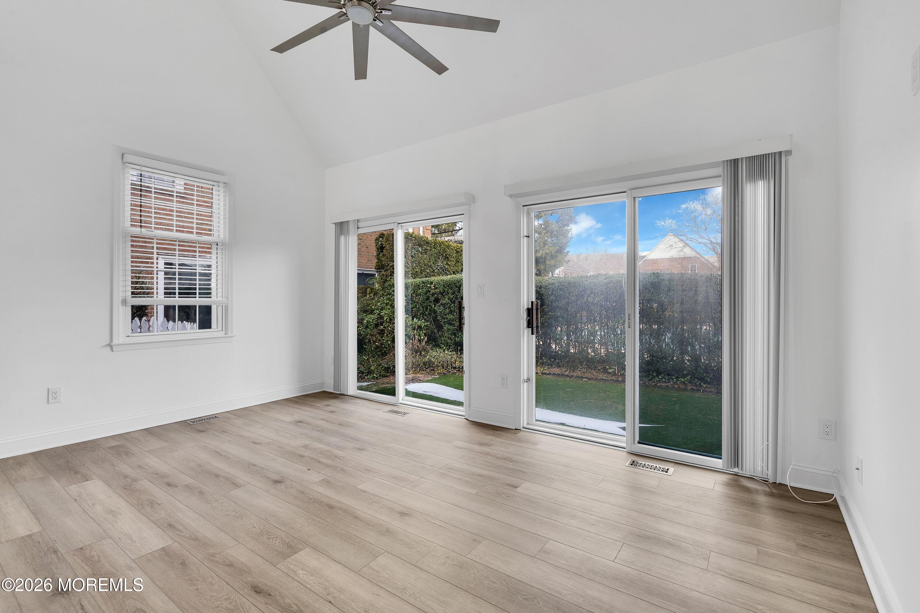 15 Wyckham Road Spring Lake Heights, NJ 07762 - Photo 2 of 38 an empty room with wooden floor and windows