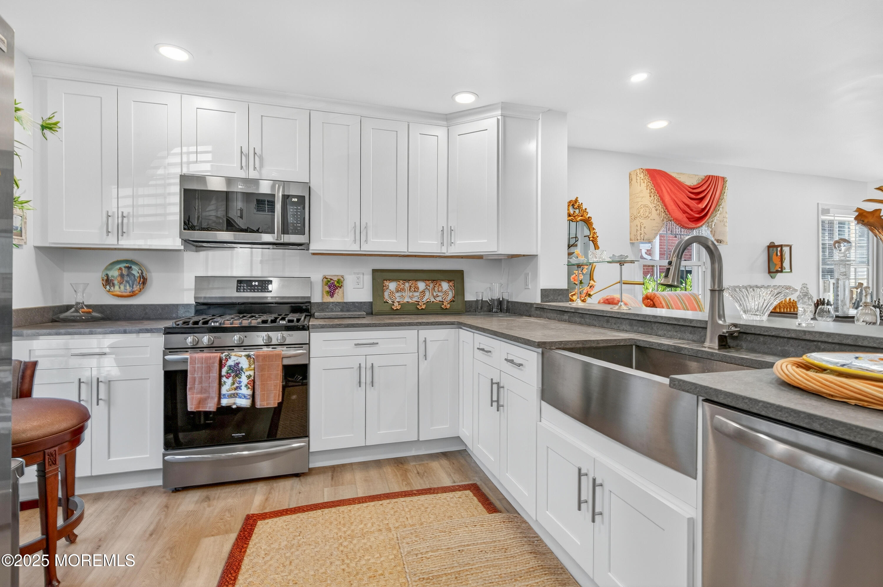 15 A Wyckham Road Spring Lake Heights, NJ 07762 - Photo 2 of 12 a kitchen with stainless steel appliances kitchen island granite countertop a sink and cabinets