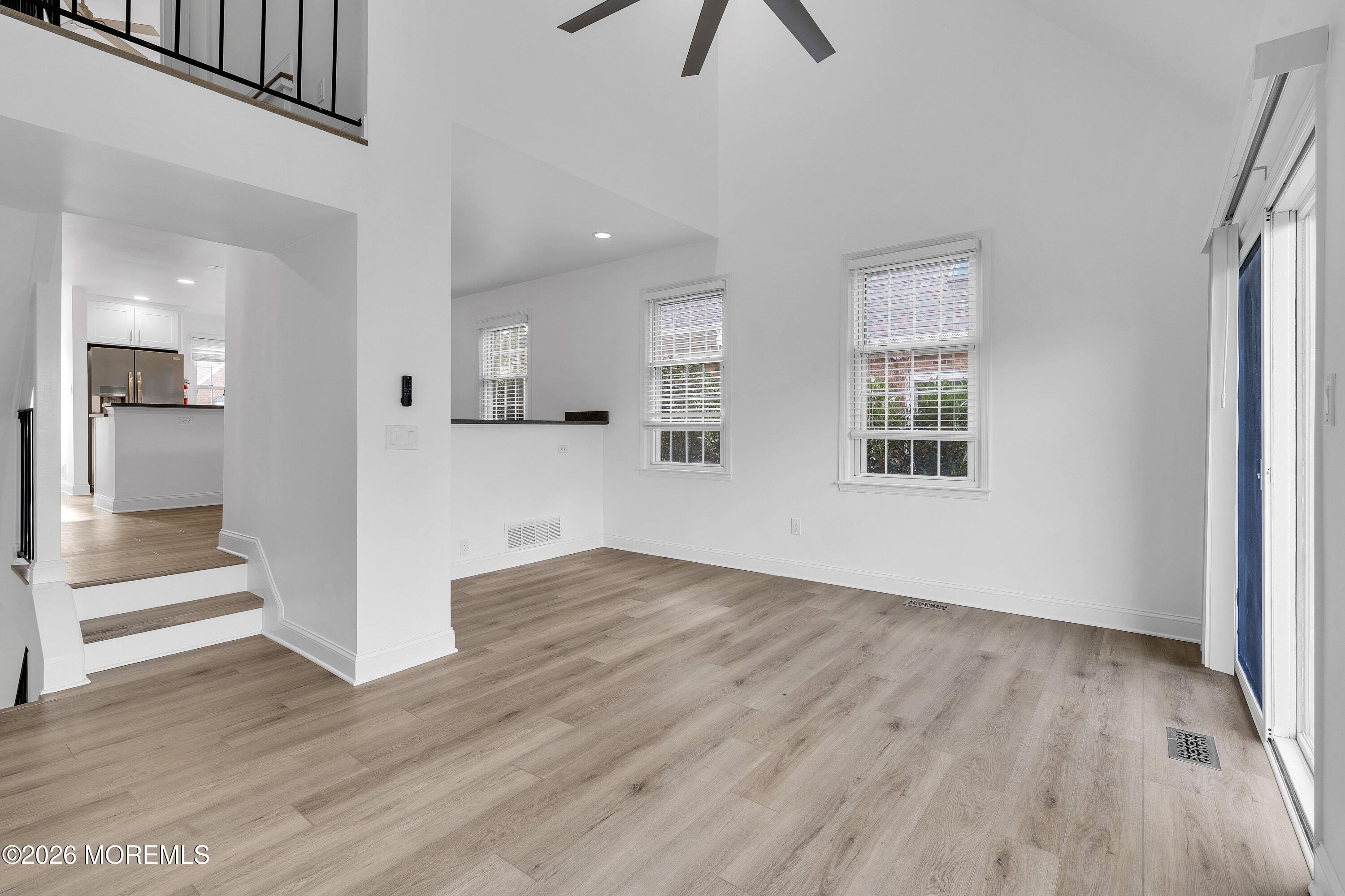 15 Wyckham Road Spring Lake Heights, NJ 07762 - Photo 3 of 38 wooden floor in an empty room with a window