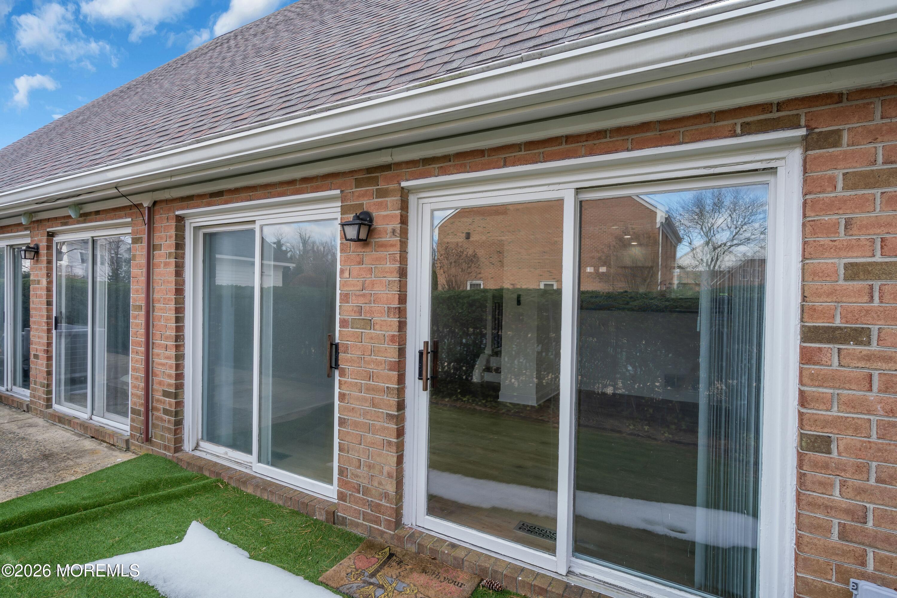 15 Wyckham Road Spring Lake Heights, NJ 07762 - Photo 32 of 38 a view of a glass door of the house