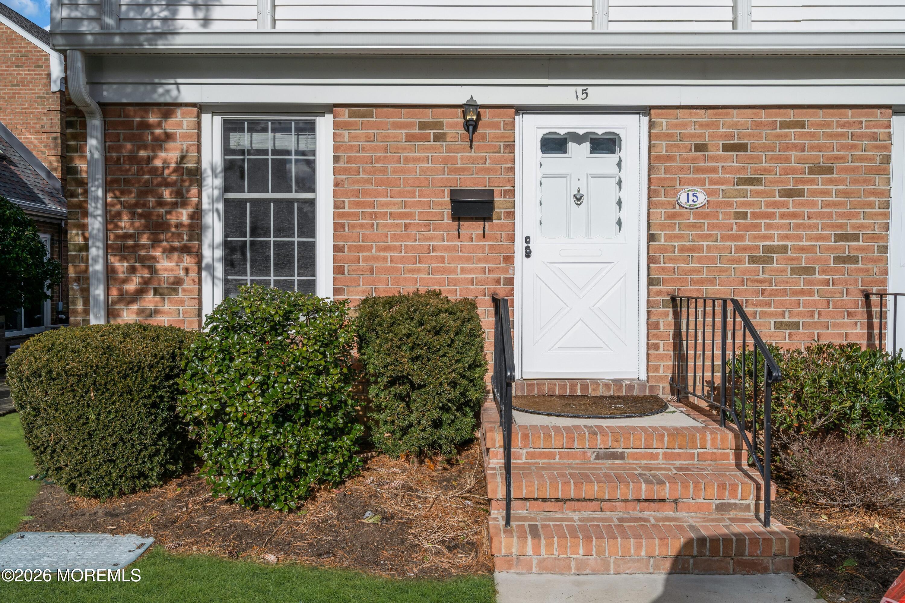 15 Wyckham Road Spring Lake Heights, NJ 07762 - Photo 33 of 38 a front view of a house with a garden