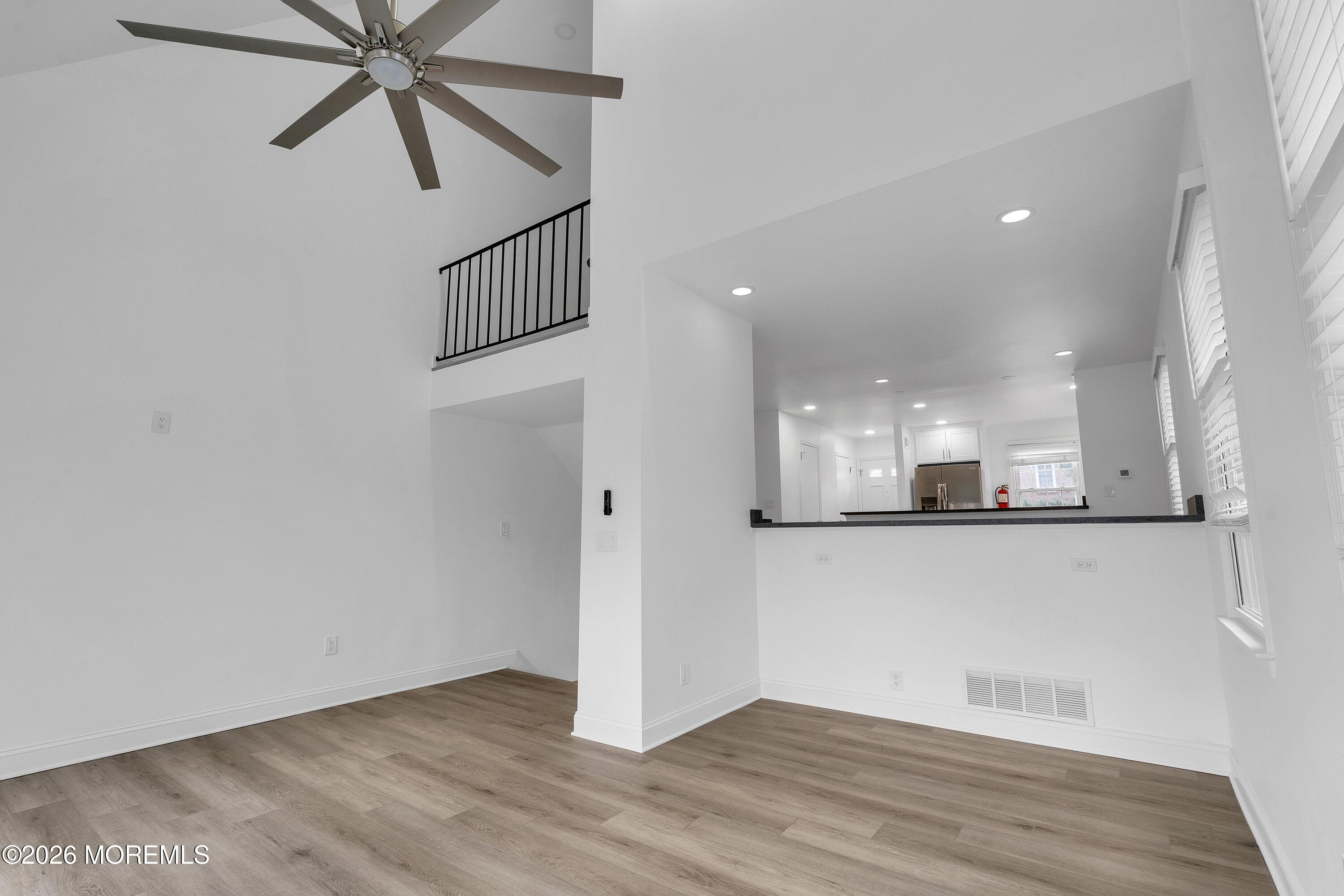 15 Wyckham Road Spring Lake Heights, NJ 07762 - Photo 5 of 38 a view of a hallway with wooden floor and entryway