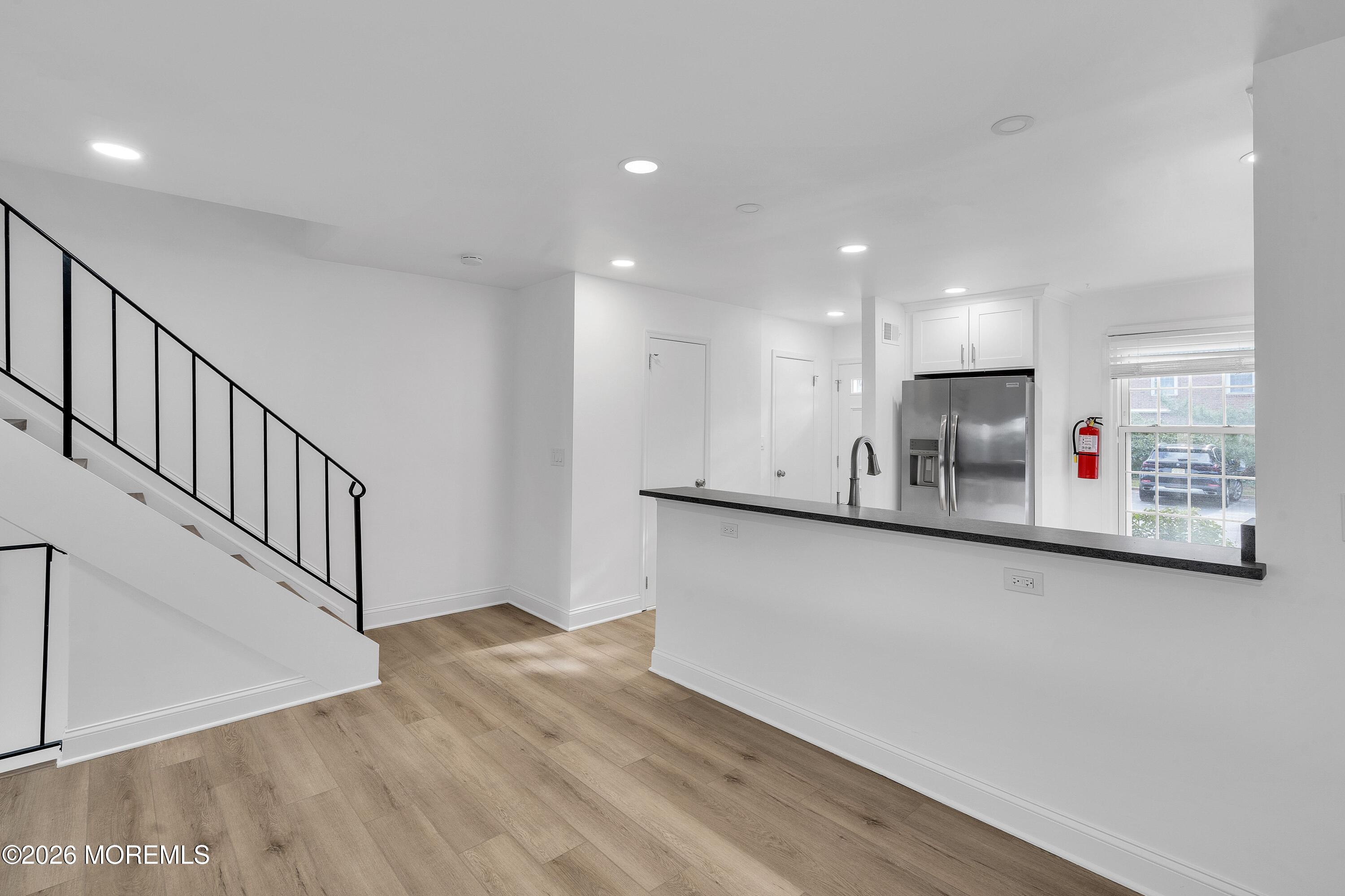 15 Wyckham Road Spring Lake Heights, NJ 07762 - Photo 8 of 38 a view of kitchen with cabinets and wooden floor