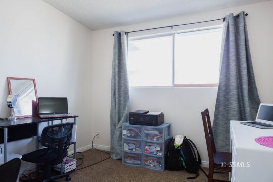 308 West Howell Avenue Ridgecrest, CA 93555 - Photo 20 of 32 a view of workspace with furniture and a window