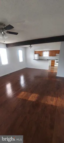 a kitchen with granite countertop a sink and a stove