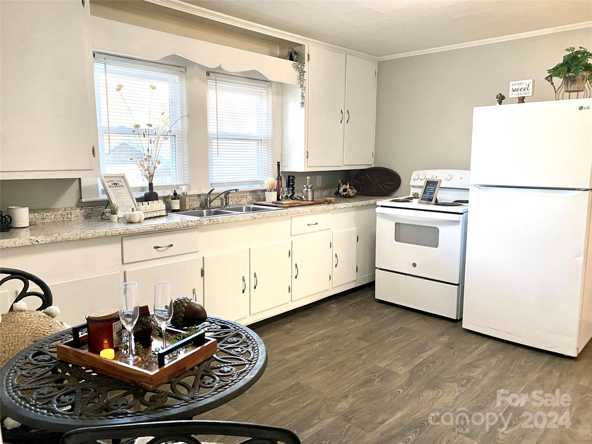 417 East Rice Street Landis, NC 28088 - Photo 11 of 22 a kitchen with a stove and a refrigerator