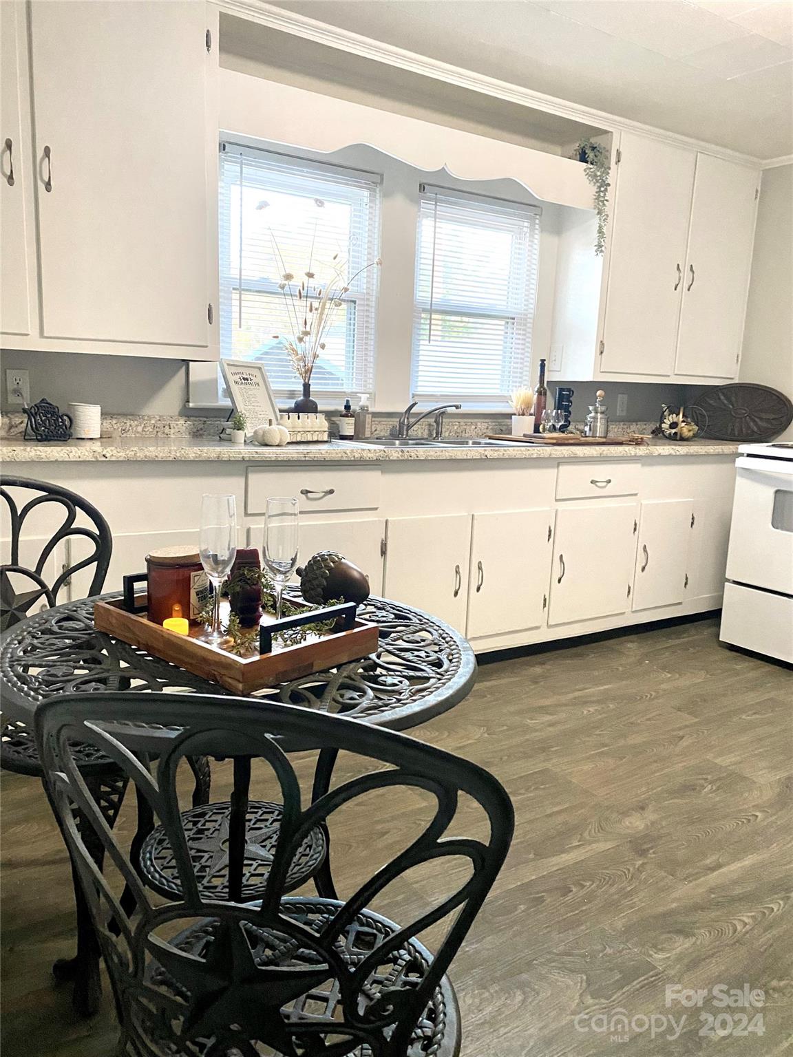 417 East Rice Street Landis, NC 28088 - Photo 12 of 22 a kitchen with a table chairs sink and cabinets