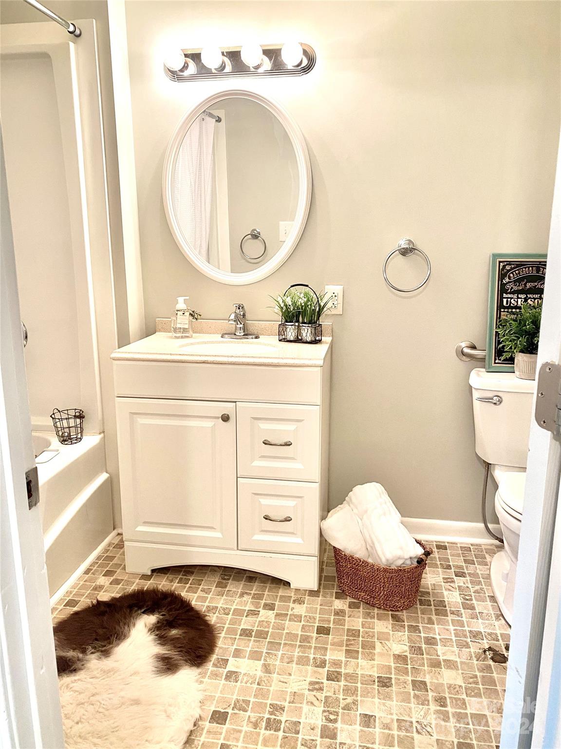 417 East Rice Street Landis, NC 28088 - Photo 20 of 22 a bathroom with a sink toilet and mirror