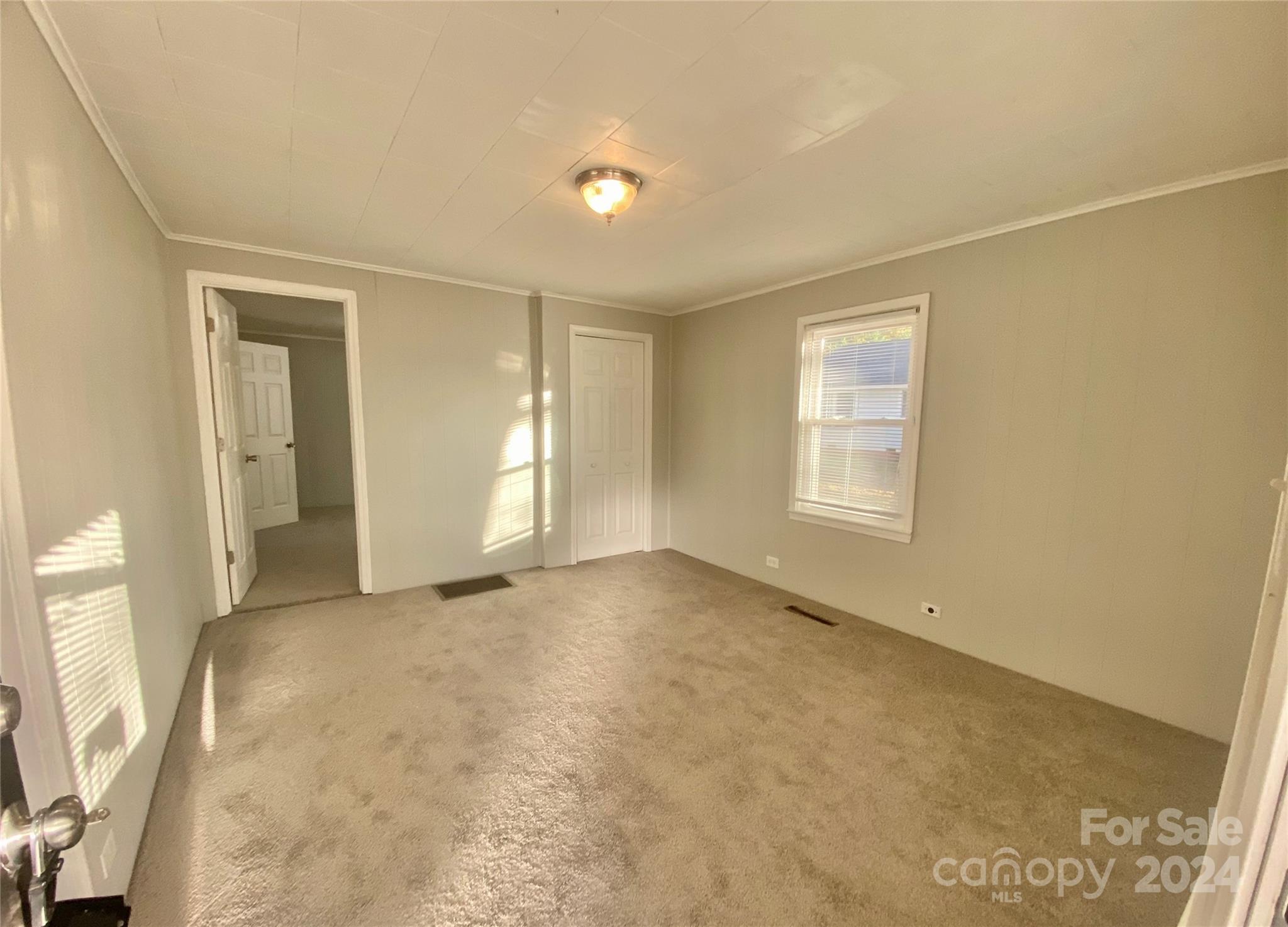 417 East Rice Street Landis, NC 28088 - Photo 5 of 22 an empty room with windows