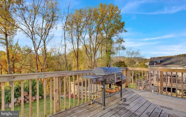 a view of a balcony with lake view and wooden floor