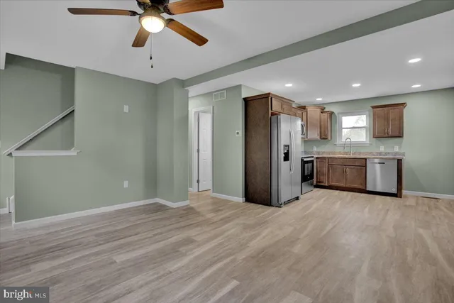 a view of a kitchen with a sink and cabinet area