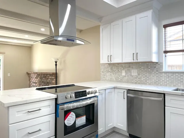 a kitchen with a stove and a sink