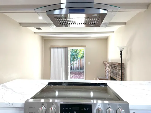 a view of barbeque grill with granite counter top