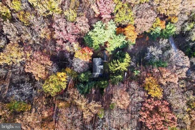 a view of a large mountain with mountains in the background