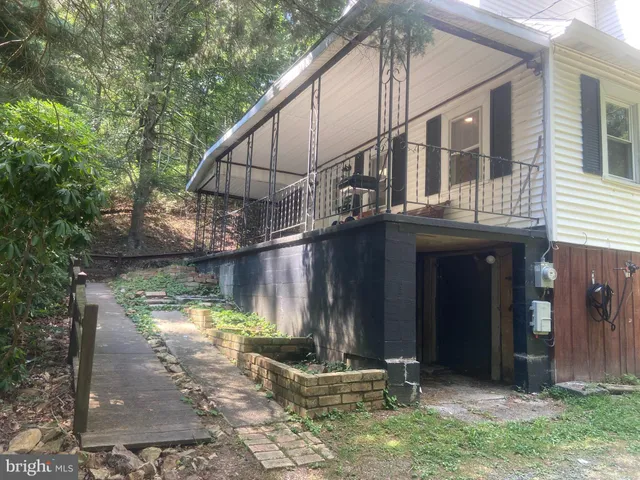 a room with a fireplace and a mirror