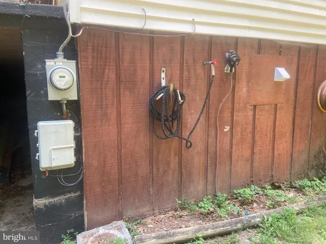 a view of storage and utility room with racks on the wall