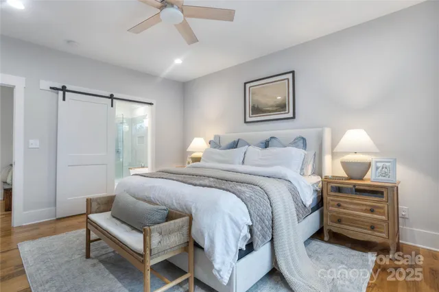 a white bath tub sitting next to a shower