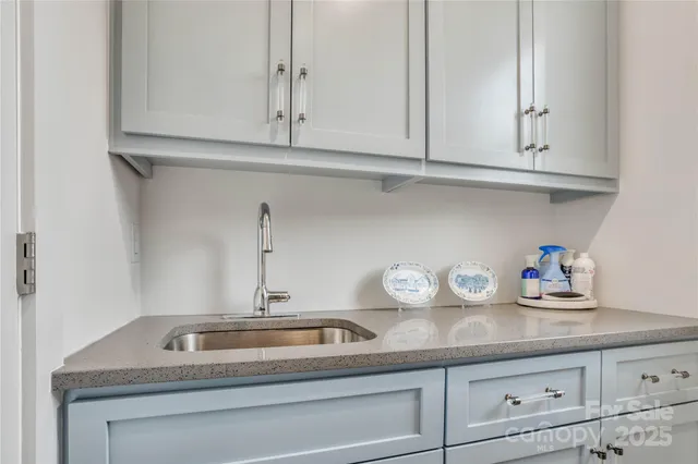 a bedroom with a bed and a mirror