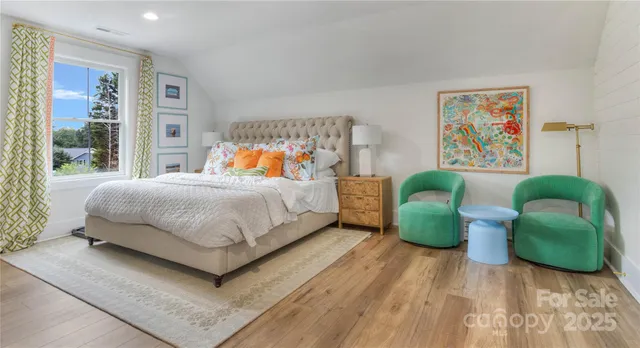 a living room with couch and a floor to ceiling window