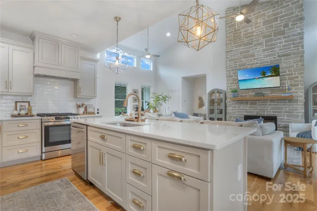 a kitchen with cabinets a sink and appliances
