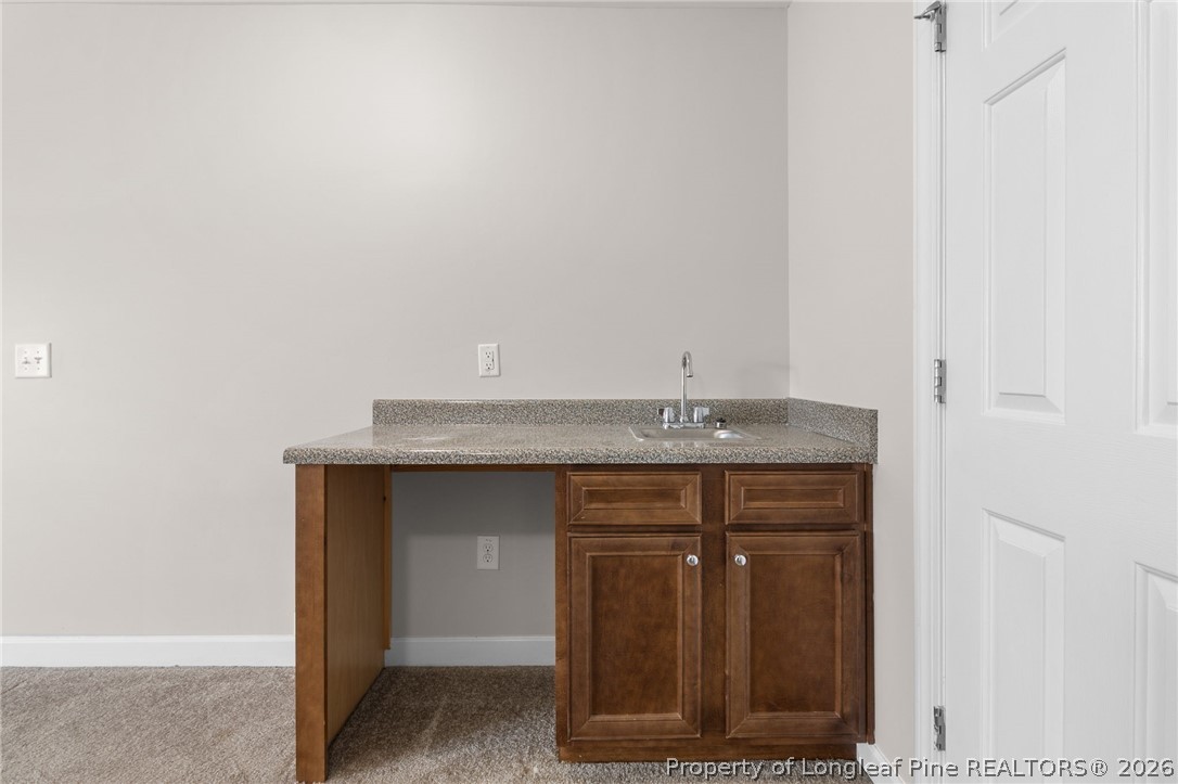 50 Huzzas Circle Cameron, NC 28326 - Photo 33 of 39 a view of hallway with granite countertop