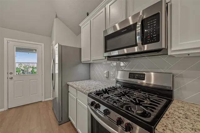 a kitchen with granite countertop sink and granite counter top