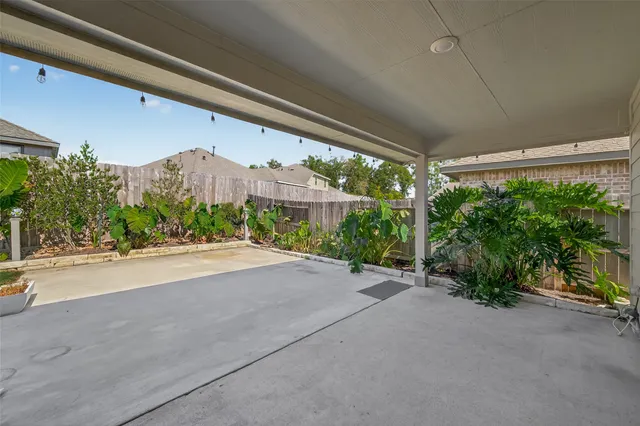 a view of a house with porch and garden