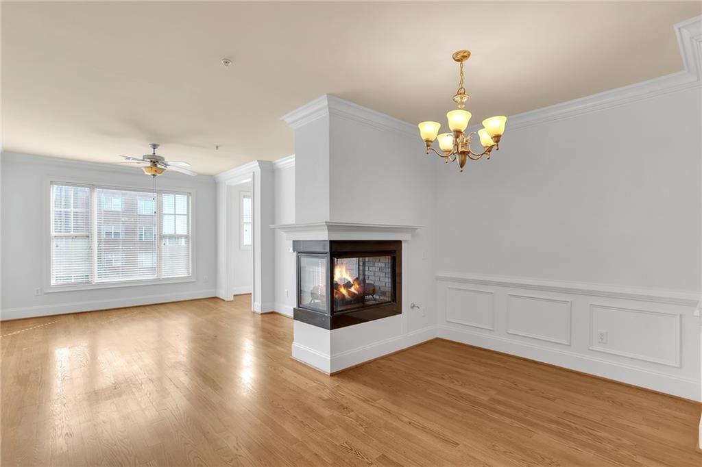 2300 Peachford Road, Unit 1209 Atlanta, GA 30338 - Photo 12 of 31 a view of an empty room with wooden floor and a window
