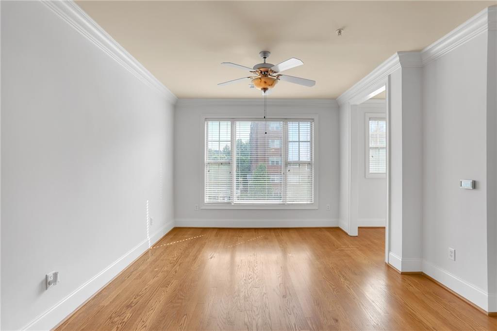 2300 Peachford Road, Unit 1209 Atlanta, GA 30338 - Photo 13 of 31 an empty room with wooden floor and windows