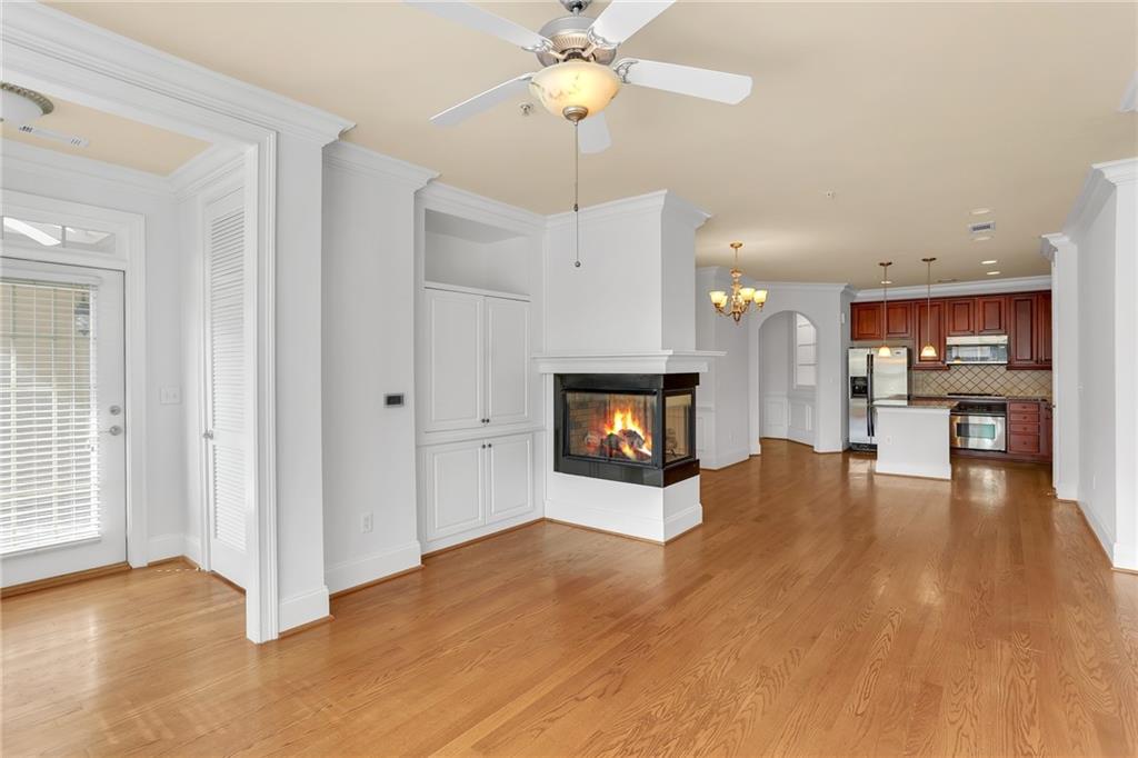 2300 Peachford Road, Unit 1209 Atlanta, GA 30338 - Photo 14 of 31 a view of kitchen and hall with fireplace